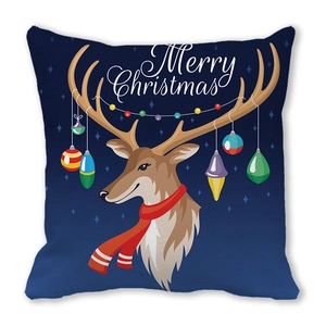 Close-up of reindeer with colorful ornaments and Merry Christmas text on blue cushion cover