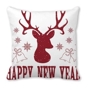 Détail des motifs de renne de Noël et de flocons sur une taie d'oreiller blanche
