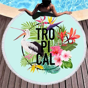 Thick round beach towel with tropical pelican and flower print with white tassels