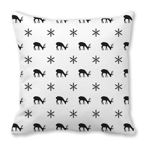 Detailed pattern of black reindeer and snowflakes printed on white Christmas pillowcase