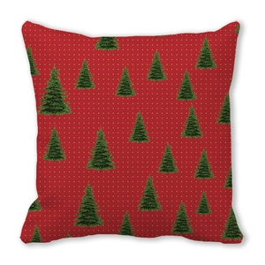 Detail of red Christmas pillowcase with green pine trees and white polka dots