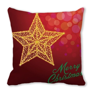 Detail of Christmas pillow cover with red base, glowing star, and Merry Christmas text