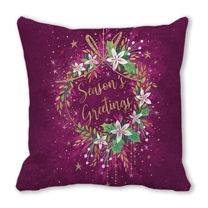 Macro view of Christmas pillowcase with star moon wreath and Seasons Greetings text