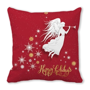 Macro detail of red festive pillow cover with angel pattern and Happy Holidays text
