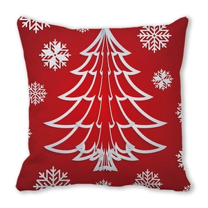 Detail of red Christmas pillowcase featuring a white cut-out style tree and snowflakes