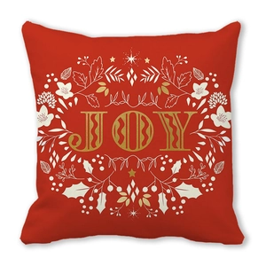 Detailed close-up of a festive red Christmas pillowcase with JOY text and star patterns