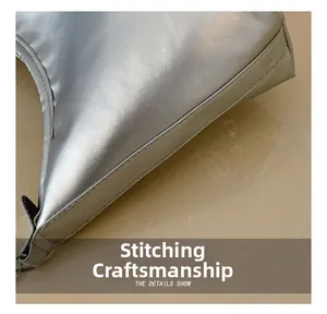 Close-up of the silver tote bag featuring high-quality double stitching craft details
