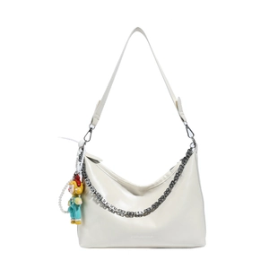 White crescent hobo bag with silver chain, pearl charm and cartoon pendant detail
