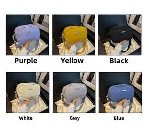 Multiple color options of compact nylon crossbody bags in purple, yellow, and blue