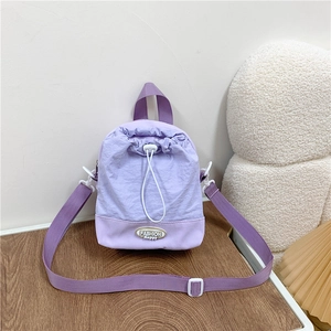Lavender functional crossbody bag with drawstring closure and adjustable strap for street style