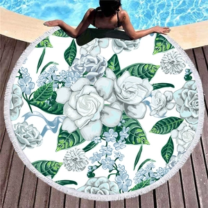Round thick beach towel with gardenia floral pattern and white tassel fringe border