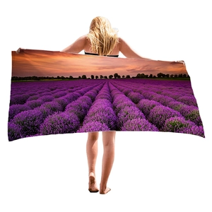 Microfiber beach towel featuring a purple lavender field at sunset with digital printing