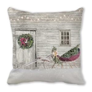 Detail of Christmas pillow cover with red sled and winter house print on peach skin fabric