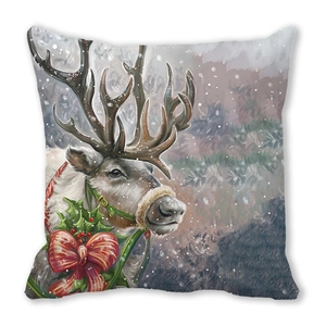 Detail of Christmas reindeer illustration with red bow on linen pillowcase surface
