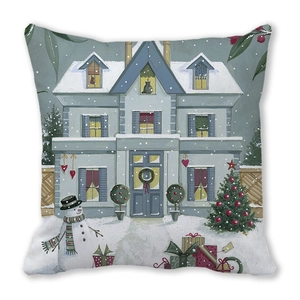 Close-up of Christmas pillow cover featuring a snow cabin, snowman and festive tree print