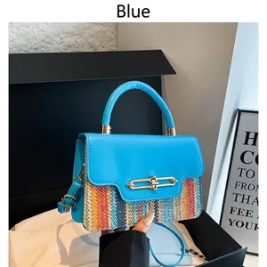 Blue crossbody bag with woven straw texture and gold metal buckle for women