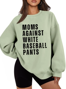Detail of light green oversized sweatshirt featuring black letter print and drop shoulder