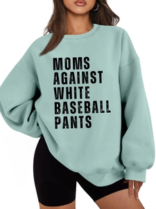 Detail view of mint green oversized fleece sweatshirt with bold black slogan print