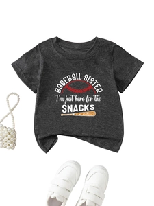 Flat lay of gray baseball sister t-shirt with sports prints and cute accessories