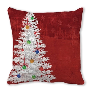 Close-up of red Christmas pillow case with white tree pattern and festive ornaments
