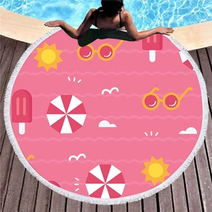 Pink round summer beach towel with sun and popsicle prints and white fringe tassels