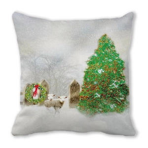 Close-up of linen pillowcase with Christmas tree, lambs, and holiday wreath design