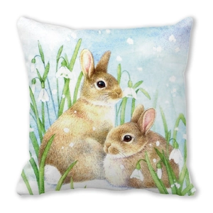 Detail of square cushion cover with watercolor brown rabbits and snowdrop flowers print