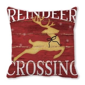 Detail of red Christmas pillowcase with golden reindeer and Reindeer Crossing text