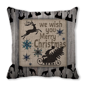 Close-up of Christmas pillowcase with reindeer silhouettes and festive typography print