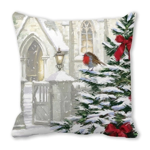 Close-up of Christmas pillow cover with robin bird and snowy church oil painting