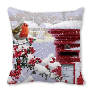 Detail of winter cushion cover with robin on a red post box and snowy village scene