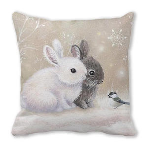 Macro detail of the soft texture and festive winter rabbit illustration on pillow cover