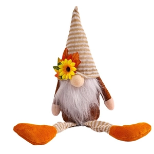 Autumn gnome plush with sunflower on striped hat and orange feet for Thanksgiving