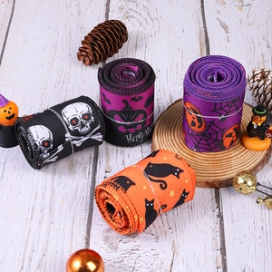 Halloween ribbon set with pumpkin and skull prints for DIY party decoration and gift wrapping