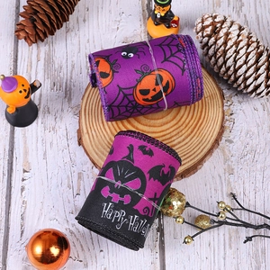 Detail of Halloween decorative ribbons with pumpkin patterns and festive theme elements