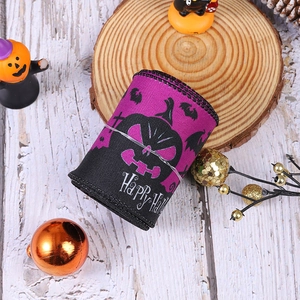 Detail of purple Halloween ribbon with pumpkin bats and Happy Halloween print