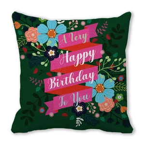 Macro detail of square peach skin pillowcase with Happy Birthday text and floral pattern