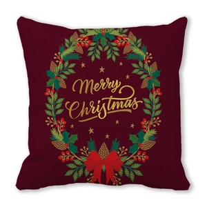 Detail of Merry Christmas pillowcase featuring a festive wreath on wine red peach skin fabric
