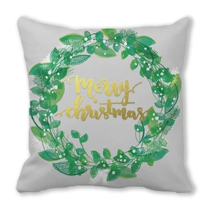 Detail of soft peach skin cushion cover with golden Merry Christmas wreath print