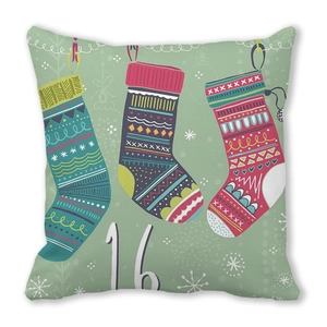 Detail of Christmas pillowcase with three colorful socks and number 16 on green background