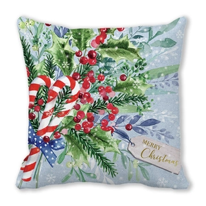 Detail van kerstkussensloop met zuurstokken, hulstbladeren en Merry Christmas tekstlabel