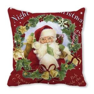 Close-up of vintage Santa Claus print on red peach skin fabric cushion cover