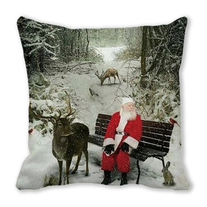 Close-up of Santa Claus and forest animals print on a square velvet pillowcase