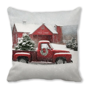 Close-up of Christmas pillowcase featuring a red truck and tree farm winter design
