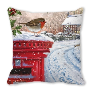 Detail of Christmas pillow cover showing a robin bird on a red mailbox and snow scene