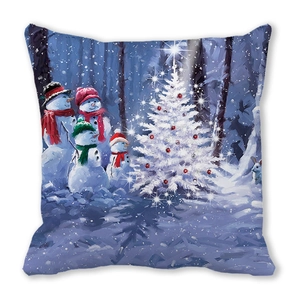 Macro detail of Christmas snowman family and festive tree print on soft square pillowcase