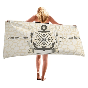 Custom nautical beach towel with anchor print and beige pebble texture on white background
