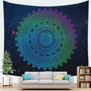 Detailed scene of starry sky mandala wall tapestry hanging over a sofa in a modern living room