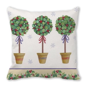 Detail of Christmas holly wreath cushions with festive bow patterns and soft fabric texture