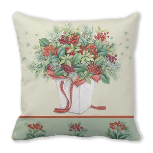 Détail d'une housse de coussin de Noël avec bouquet de baies et rubans festifs